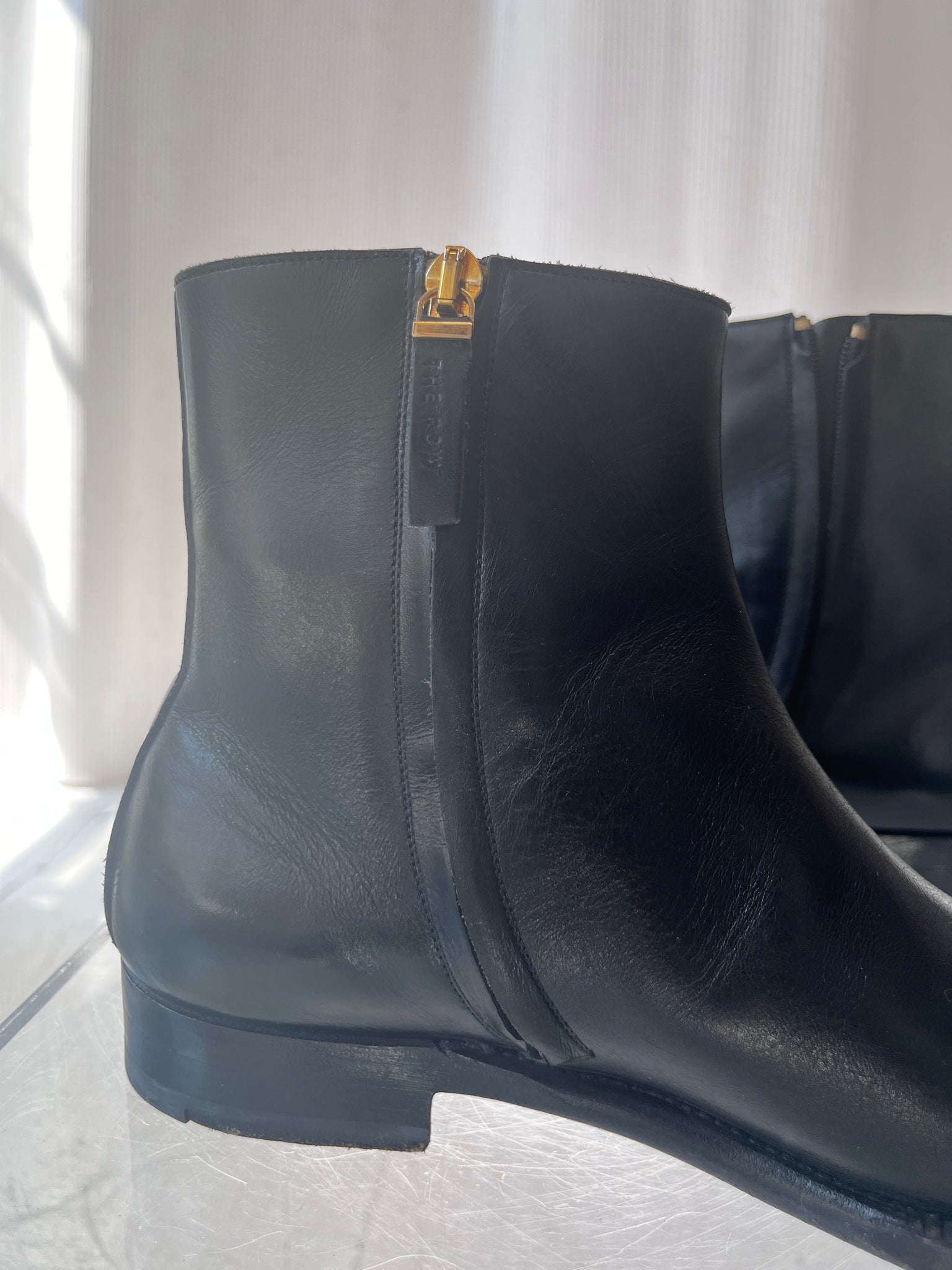 The Row black leather boot