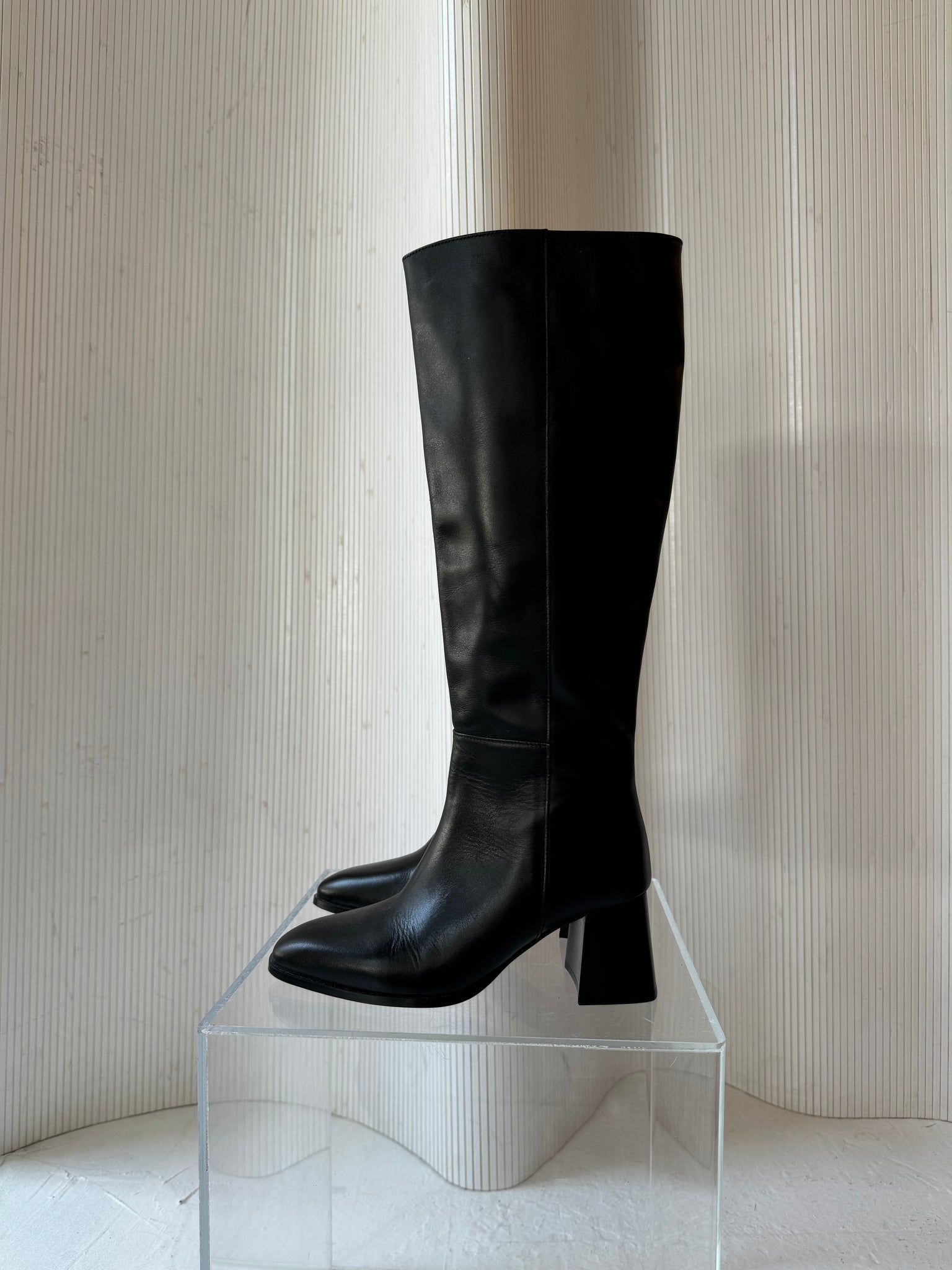 Flattered leather knee high boot